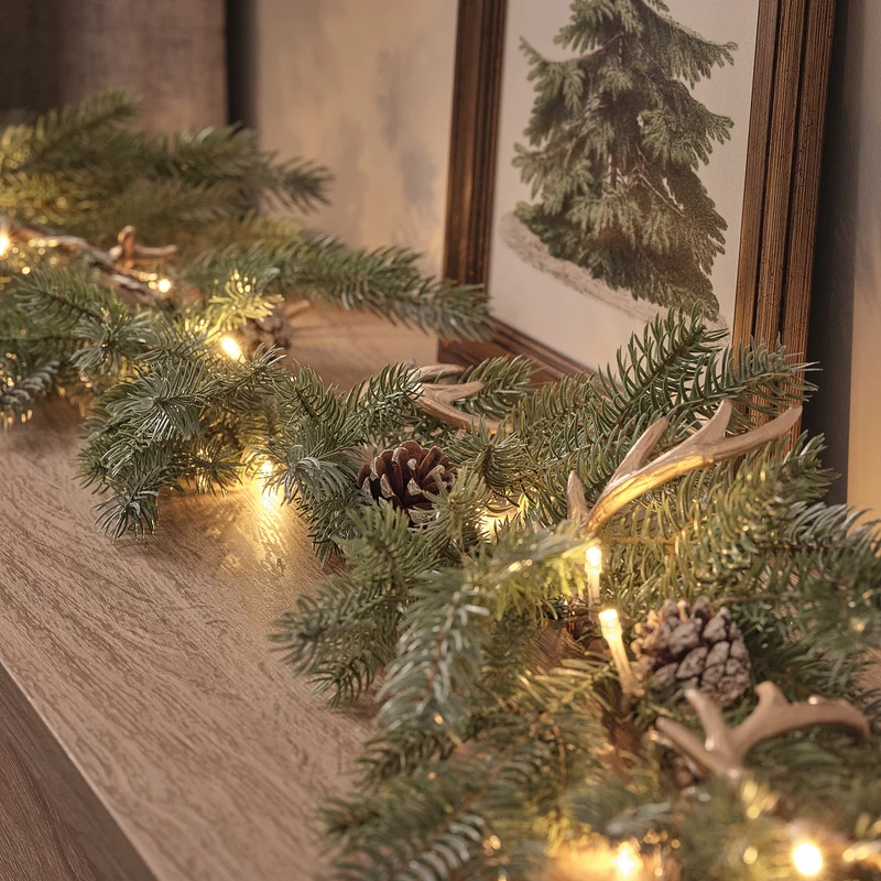 1,5 m LED-Weihnachtsgirlande mit Geweih und Tannenzapfen in Warmweiß