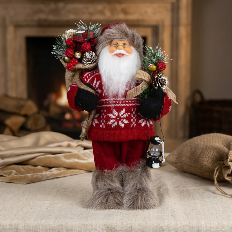 Weihnachtsmann 30 cm stehend mit Laterne, Stiefel mit Fellbesatz, Jutesack und Winterzweigen