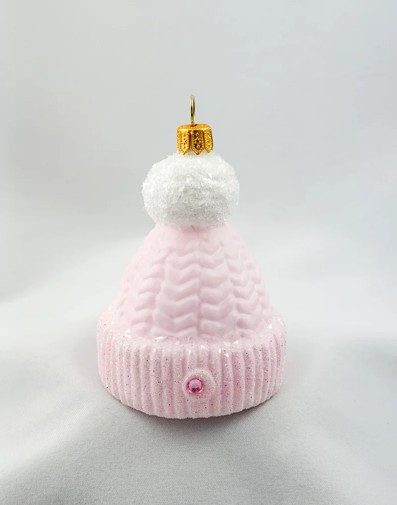 Rosa Strick-Mütze mit weissem Bommel