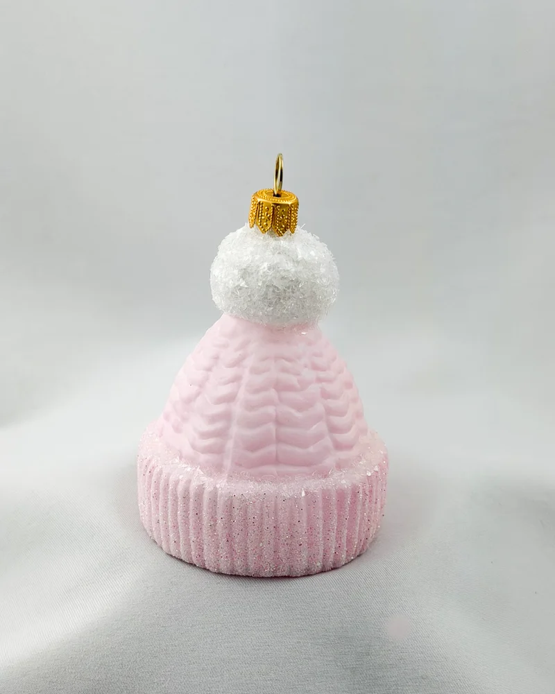 Rosa Strick-Mütze mit weissem Bommel