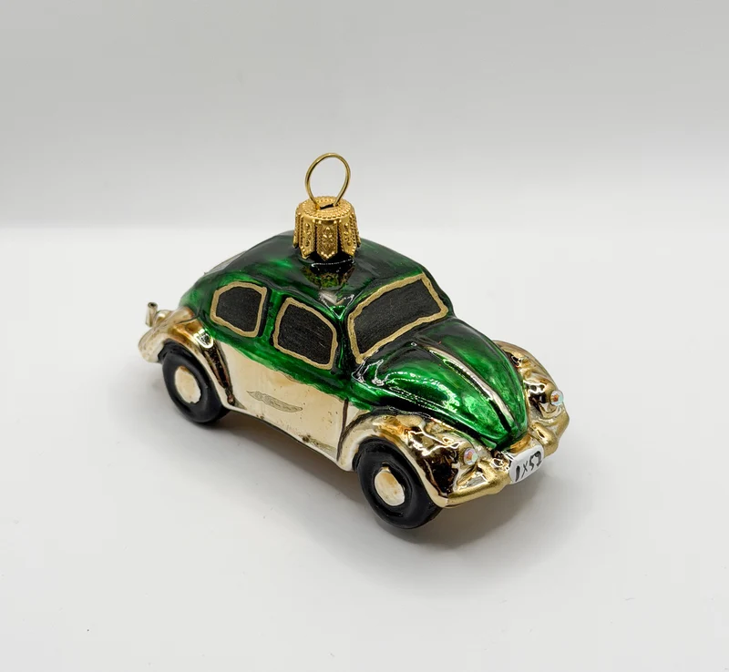 VW-Käfer gold mit grünem Dach