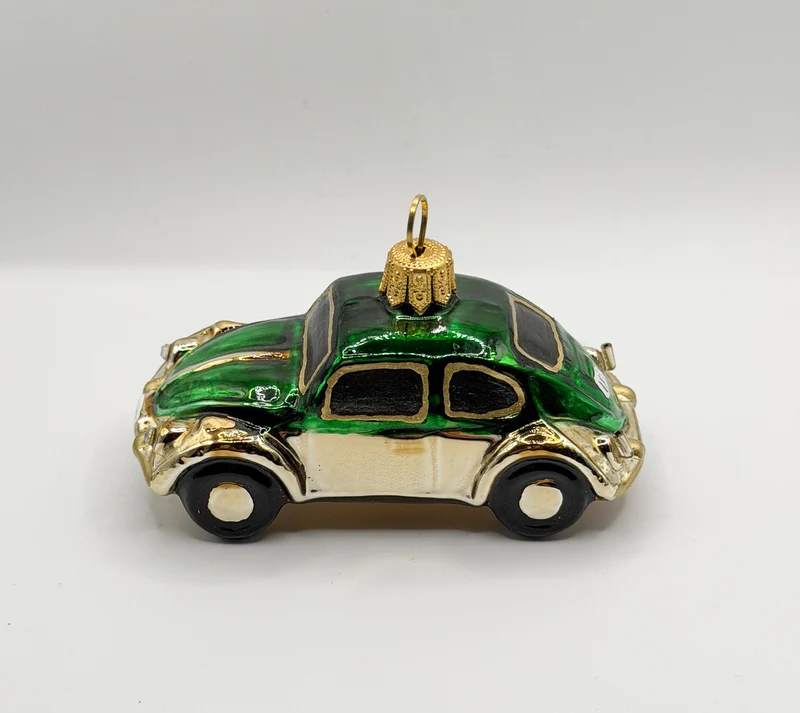 VW-Käfer gold mit grünem Dach