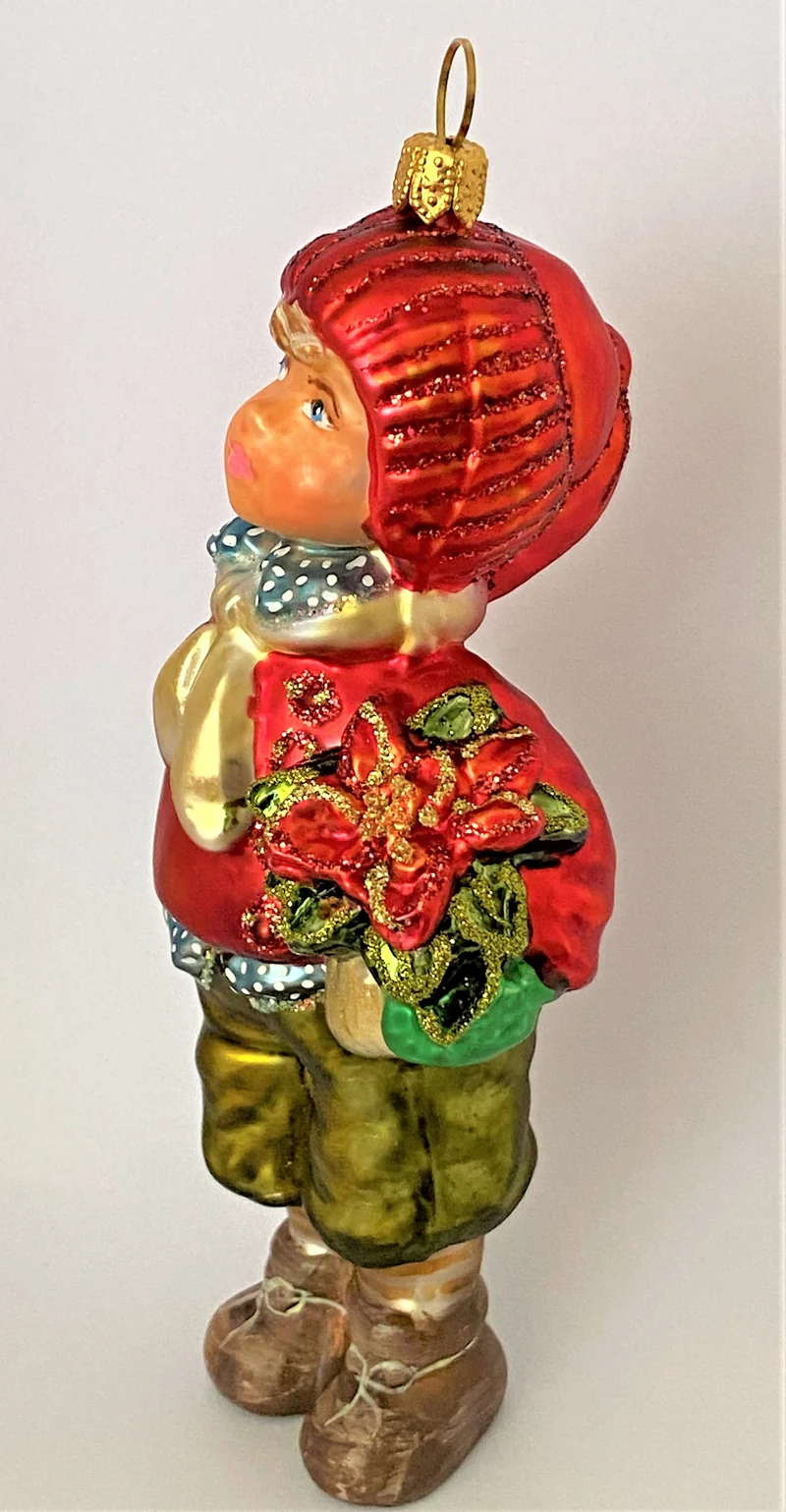 Junge mit roter Mütze und Weihnachtsstern unter dem Arm, KOMOZJA MOSTOWSKI