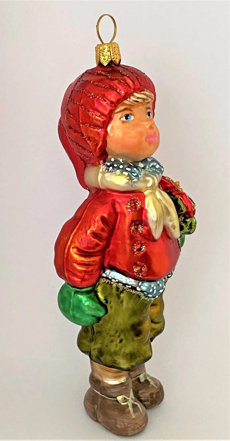 Junge mit roter Mütze und Weihnachtsstern unter dem Arm, KOMOZJA MOSTOWSKI