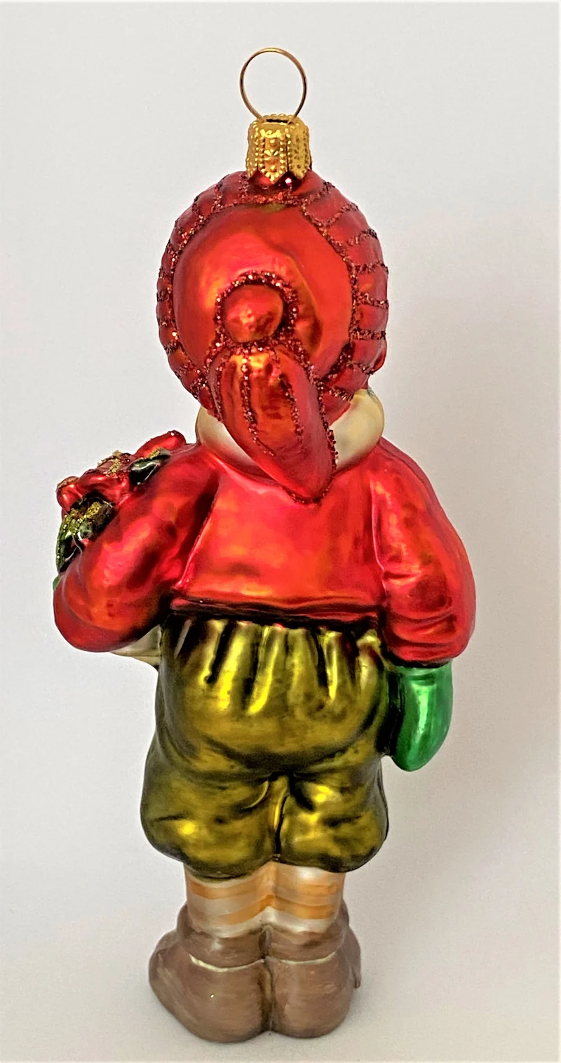 Junge mit roter Mütze und Weihnachtsstern unter dem Arm, KOMOZJA MOSTOWSKI
