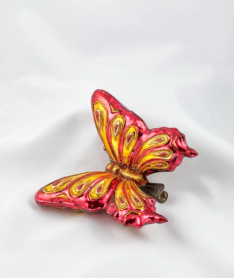 Grosser rot/goldener Schmetterling mit Clip
