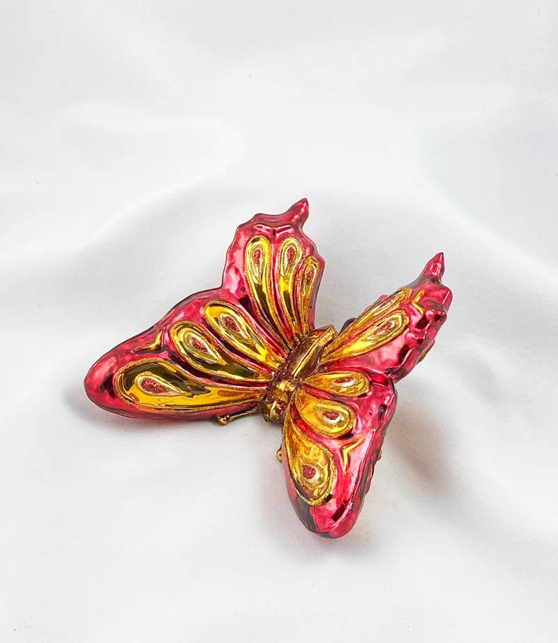 Grosser rot/goldener Schmetterling mit Clip