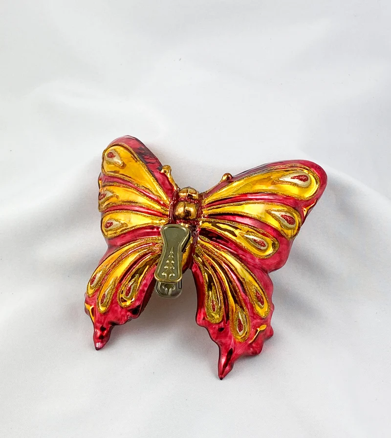 Grosser rot/goldener Schmetterling mit Clip