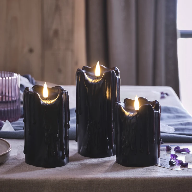 3er Set TruGlow® LED Stumpenkerzen Echtwachs schwarz mit Wachstropfen