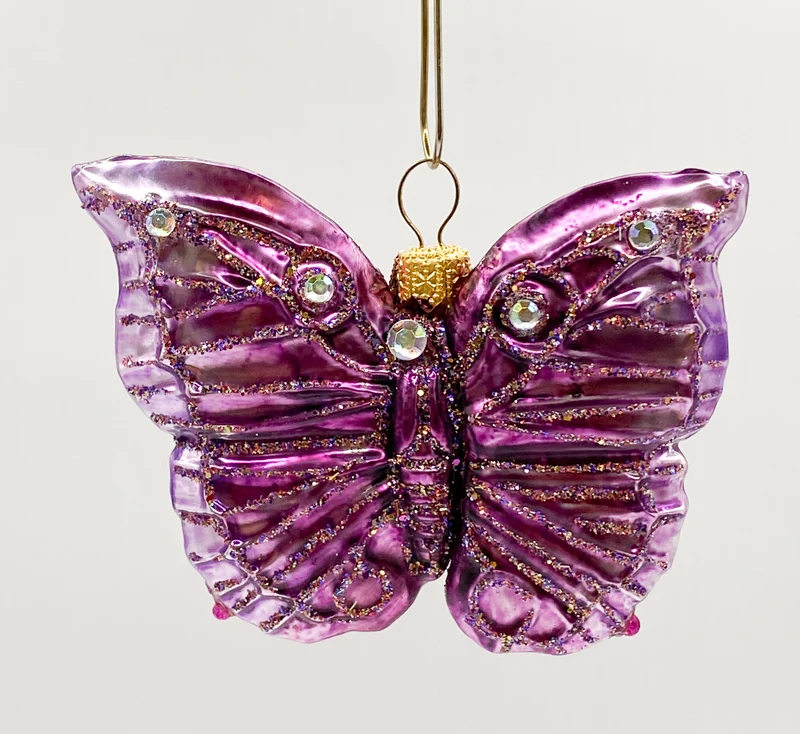 Schmetterling violett mit Schmucksteinen