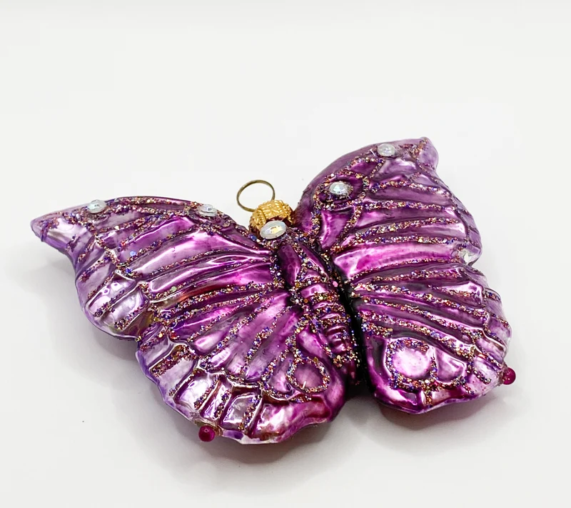 Schmetterling violett mit Schmucksteinen