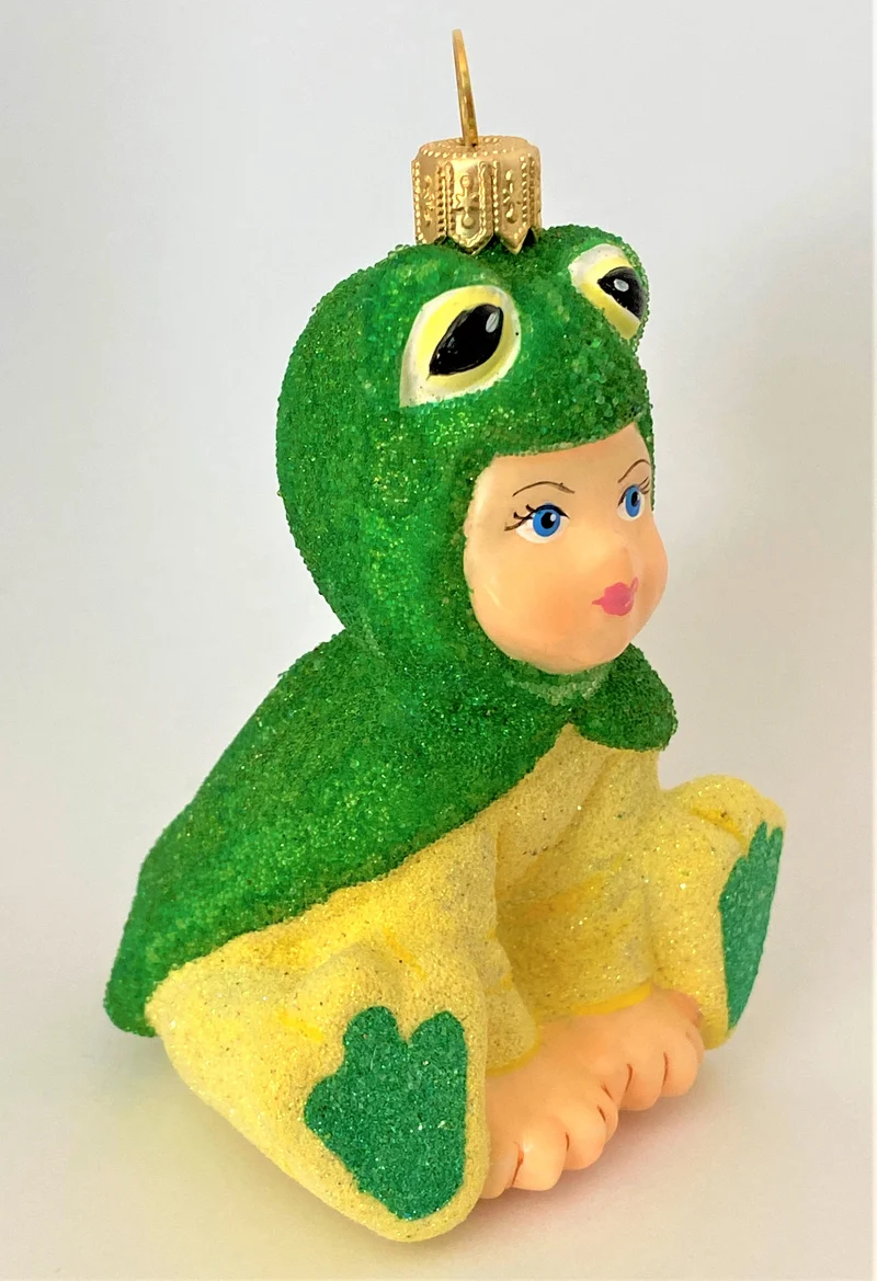 Kind im Froschkostüm, KOMOZJA MOSTOWSKI