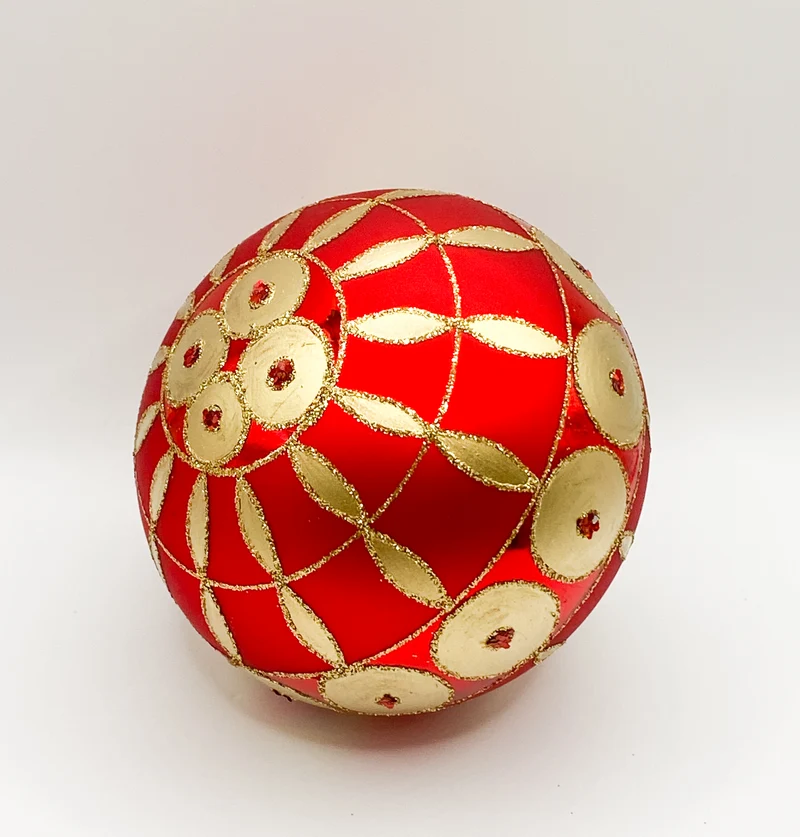 Rote Kugel mit goldenem Art-Deco Muster