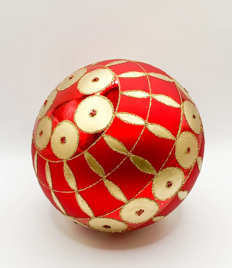 Rote Kugel mit goldenem Art-Deco Muster