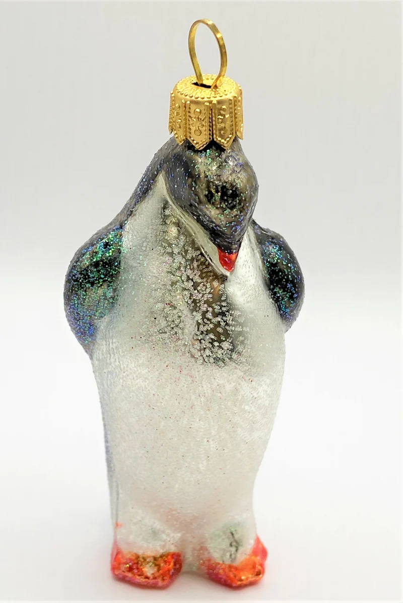 Glitzer Pinguin mit gesenktem Kopf