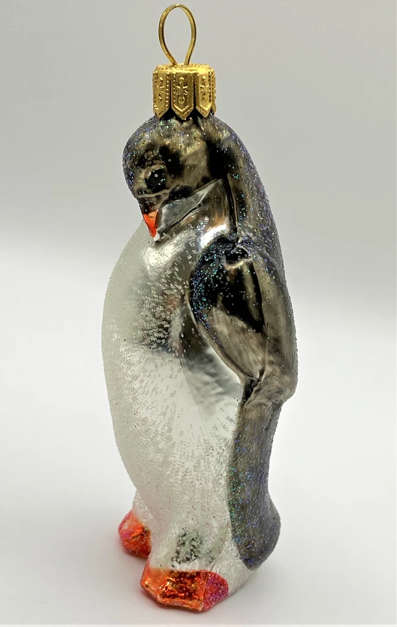 Glitzer Pinguin mit gesenktem Kopf