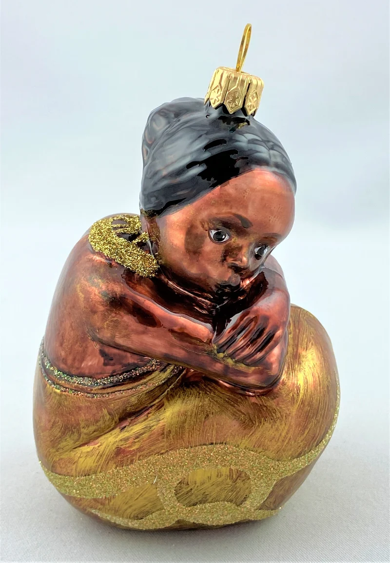 Afrikanisches Mädchen, sitzend