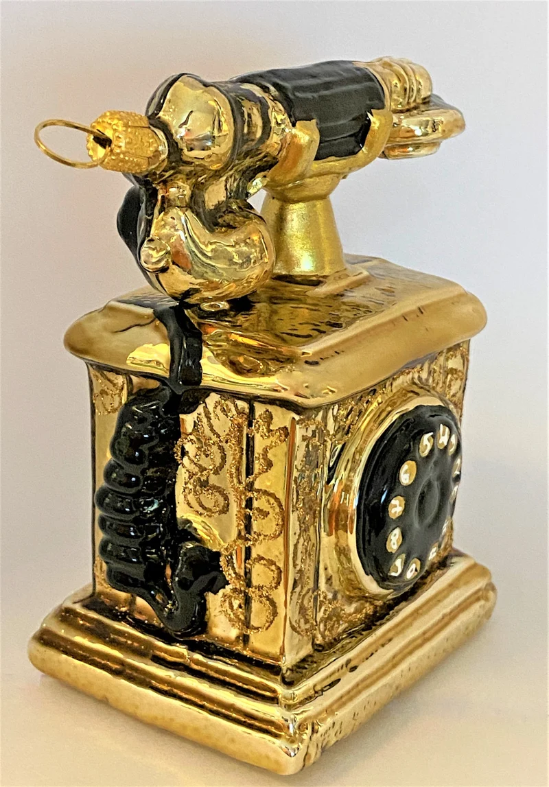Nostalgisches Telefon antikgold mit schwarzer Wählscheibe