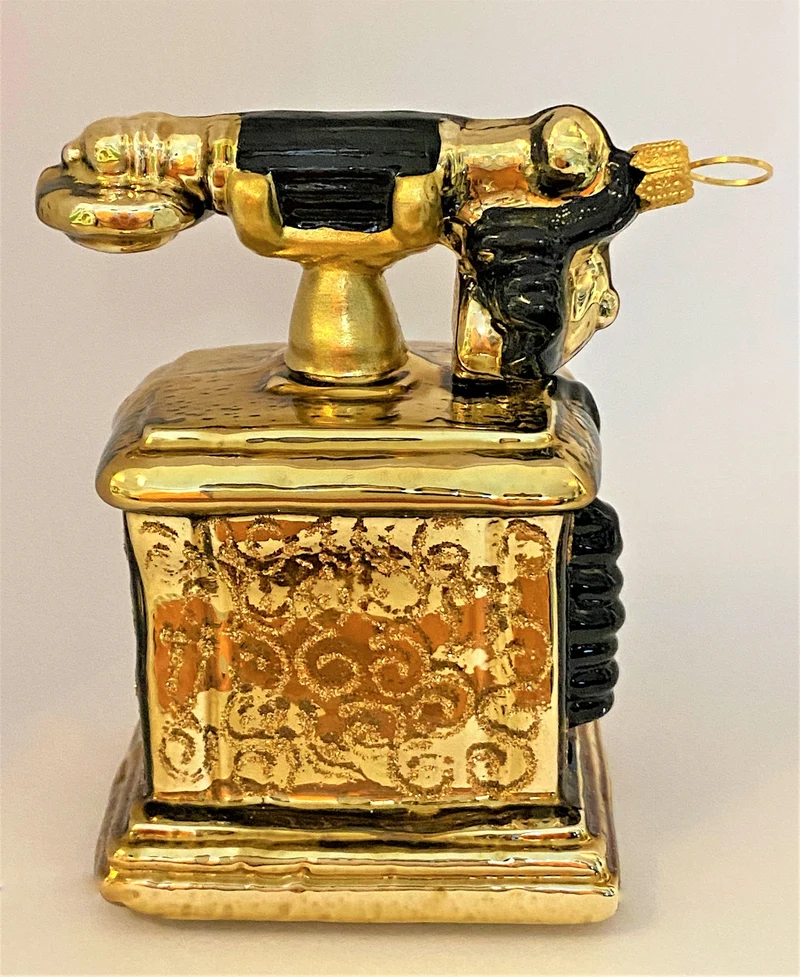 Nostalgisches Telefon antikgold mit schwarzer Wählscheibe