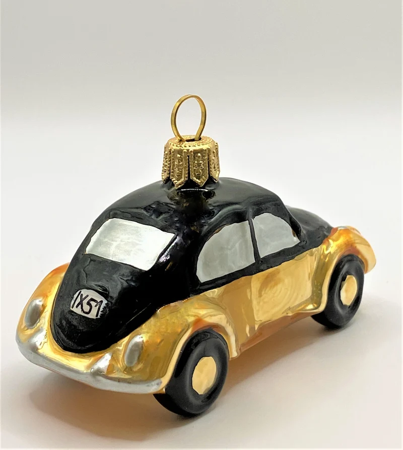 VW-Käfer gold mit schwarzem Dach