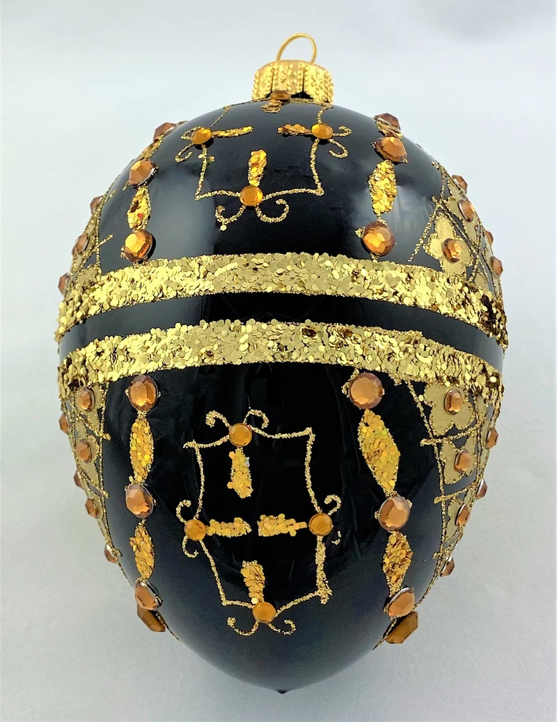 Faberge-Ei schwarz mit Golddekor mit Schmucksteinen