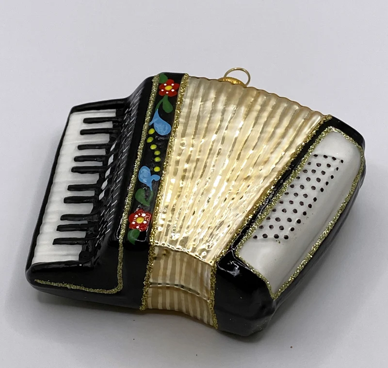 Schwarze Handorgel mit Blumendekor