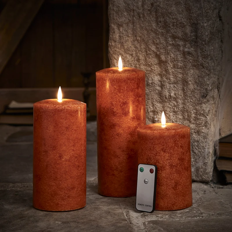 TruGlow® LED Kerzen Echtwachs Trio orange Ø 10cm mit Fernbedienung