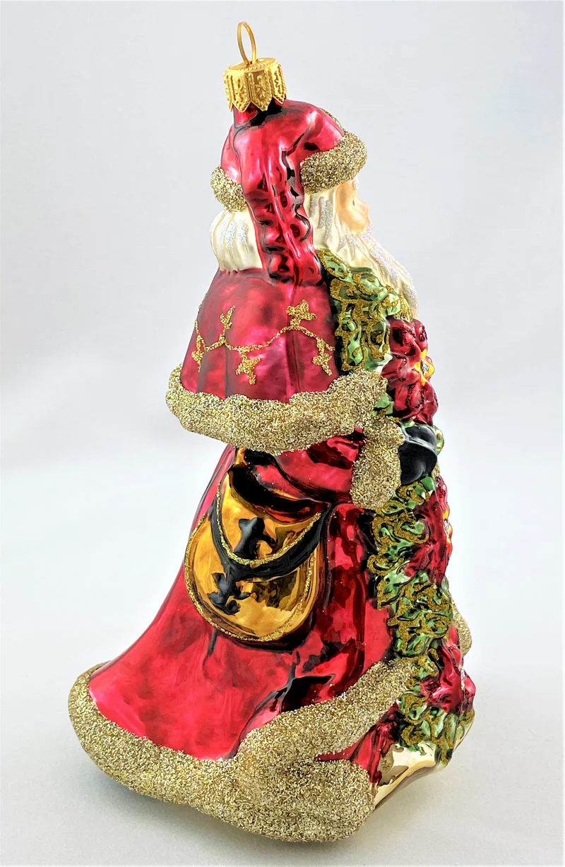Weihnachtsmann mit Weihnachtsstern und Glocke