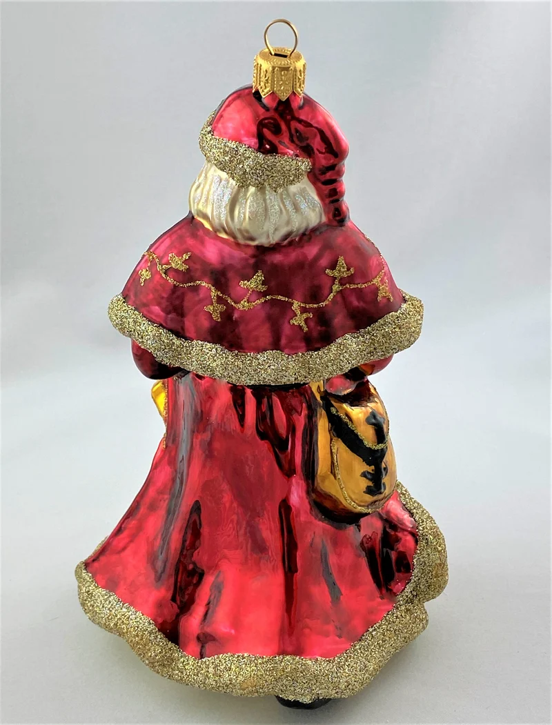 Weihnachtsmann mit Weihnachtsstern und Glocke