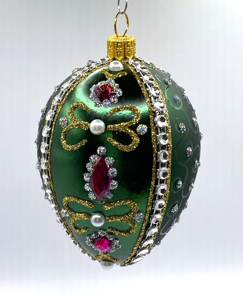 Faberge-Ei dunkelgrün mit weissen und violetten Strass-Steinen