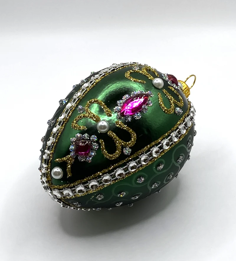 Faberge-Ei dunkelgrün mit weissen und violetten Strass-Steinen