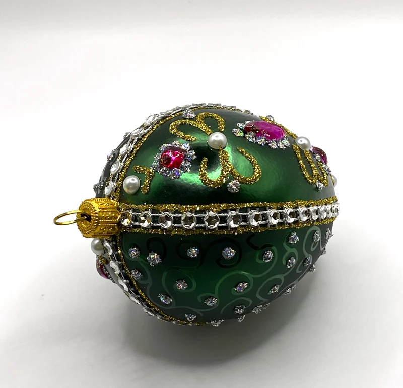 Faberge-Ei dunkelgrün mit weissen und violetten Strass-Steinen