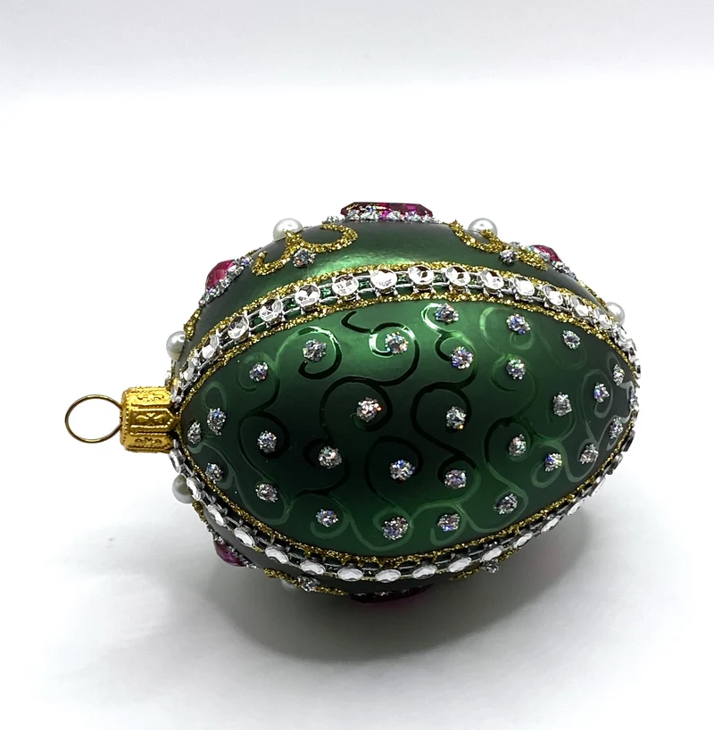 Faberge-Ei dunkelgrün mit weissen und violetten Strass-Steinen