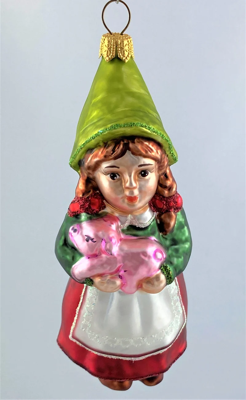 Zwergenmädchen mit rosa Schweinchen auf dem Arm
