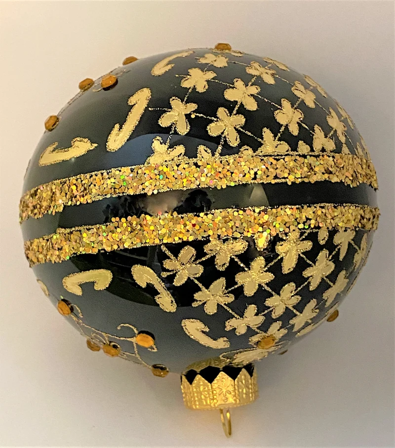 Kugel schwarz mit Golddekor mit Schmucksteinen