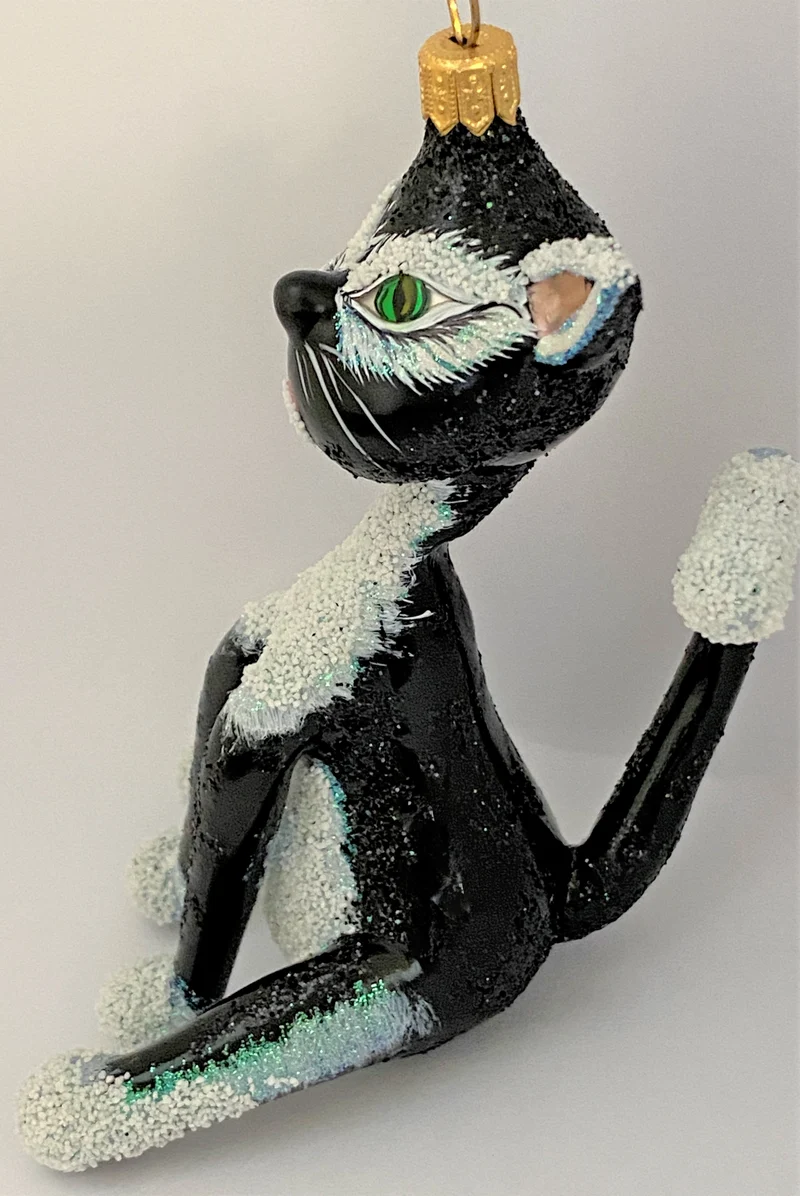 Grosse sitzende schwarze Katze