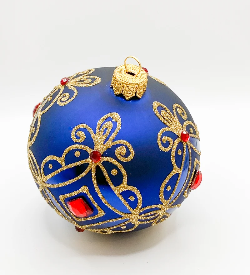 Kugel blau matt mit Golddekor, kleine und grosse rote Steine
