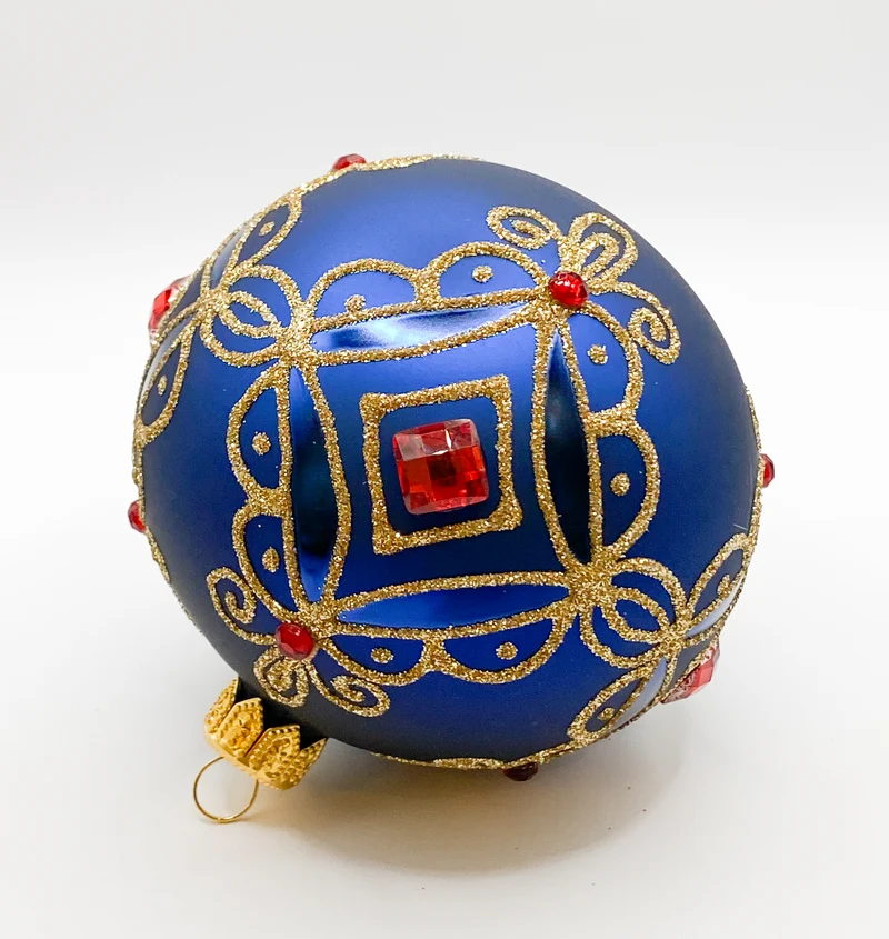 Kugel blau matt mit Golddekor, kleine und grosse rote Steine