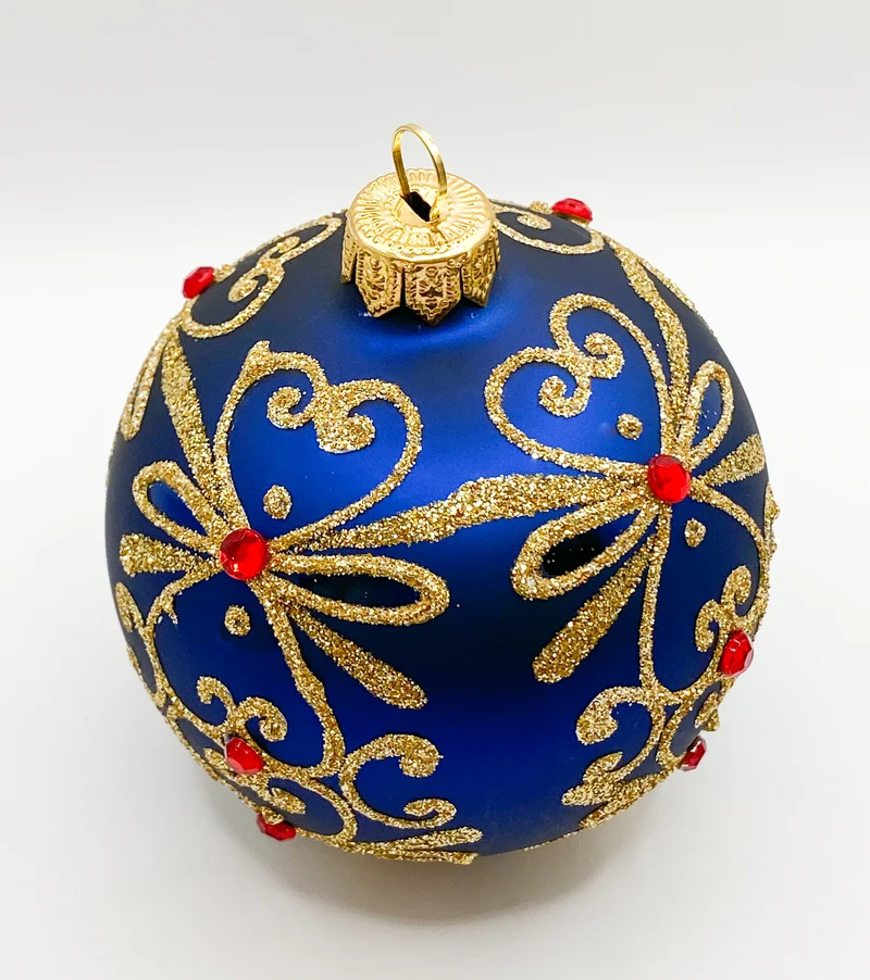 Kugel blau matt mit Golddekor und kleinen roten Steinen
