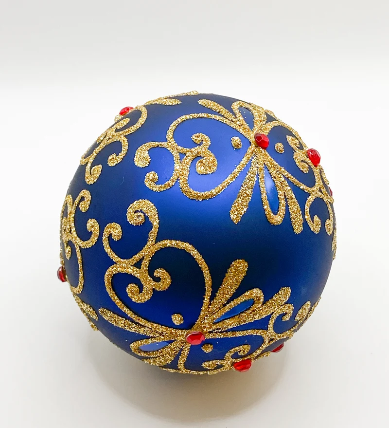Kugel blau matt mit Golddekor und kleinen roten Steinen