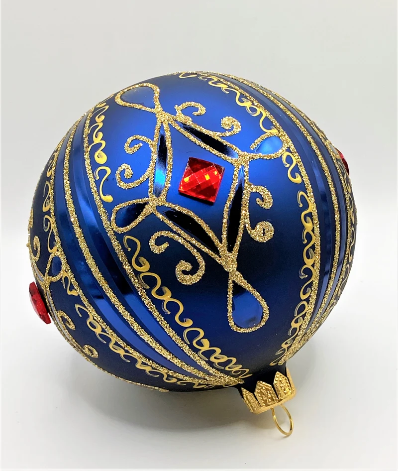 Kugel blau matt mit Golddekor, grosse rote Steine
