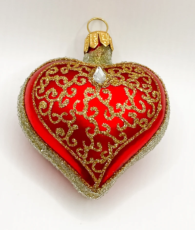 Rotes Herz mit goldenen Kringeln