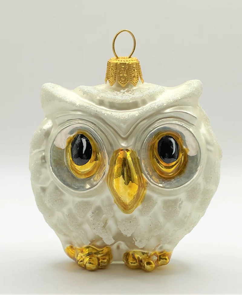 Dicke weisse Eule mit grossen Augen