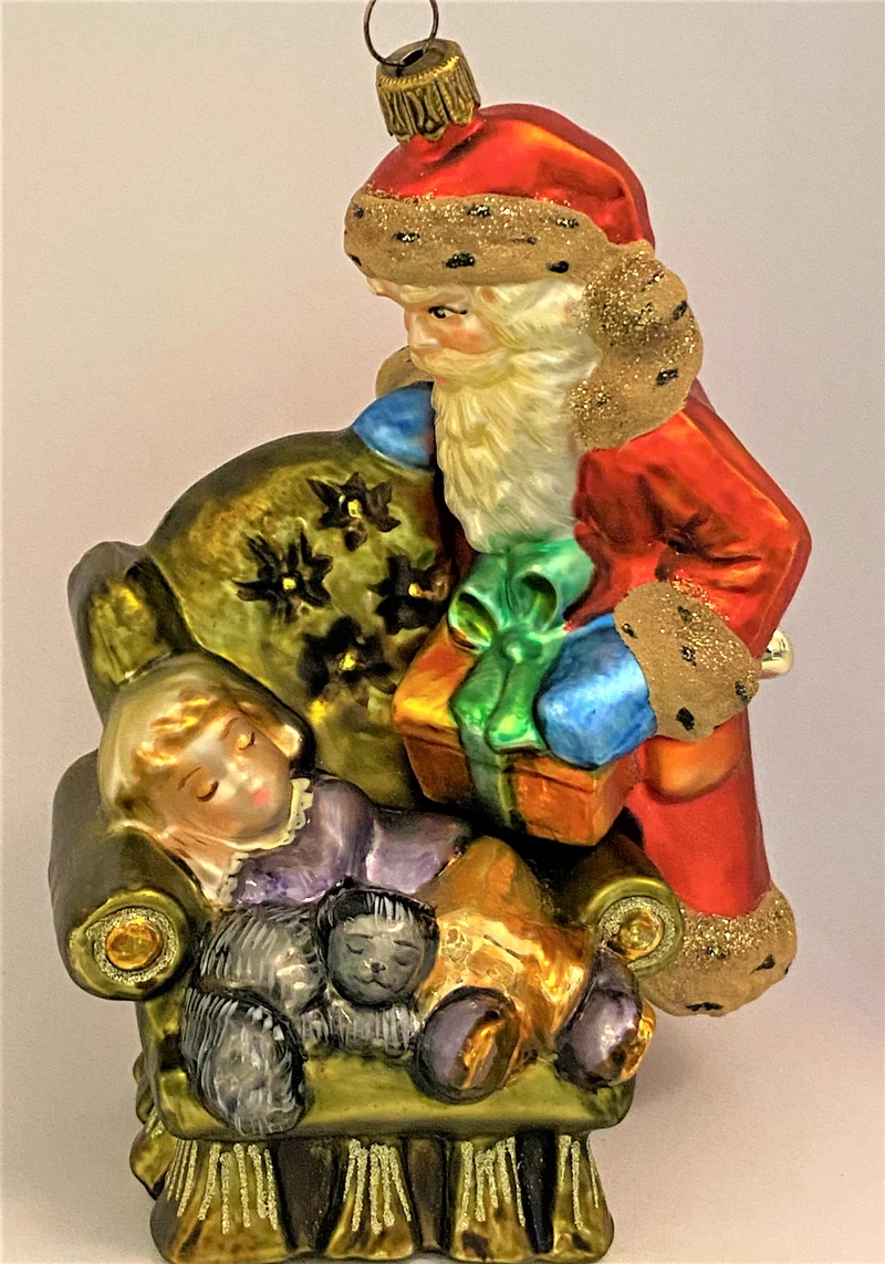 Weihnachtsmann bringt dem schlafendem Junge ein Geschenk, KOMOZJA MOSTOWSKI