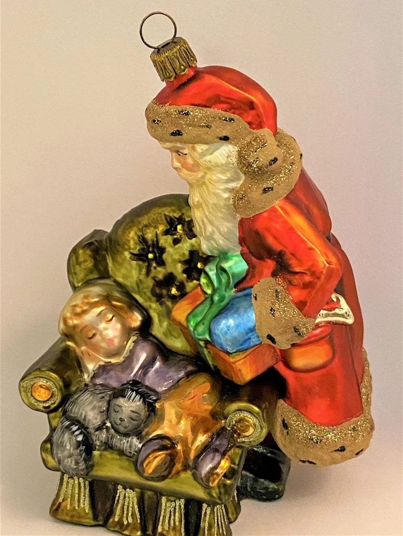 Weihnachtsmann bringt dem schlafendem Junge ein Geschenk, KOMOZJA MOSTOWSKI