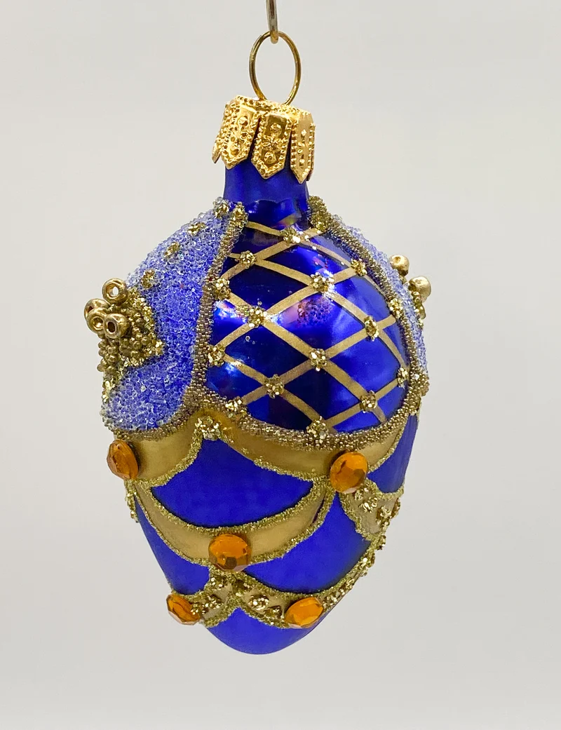 Kleines blaues Ei mit Gold-Dekor
