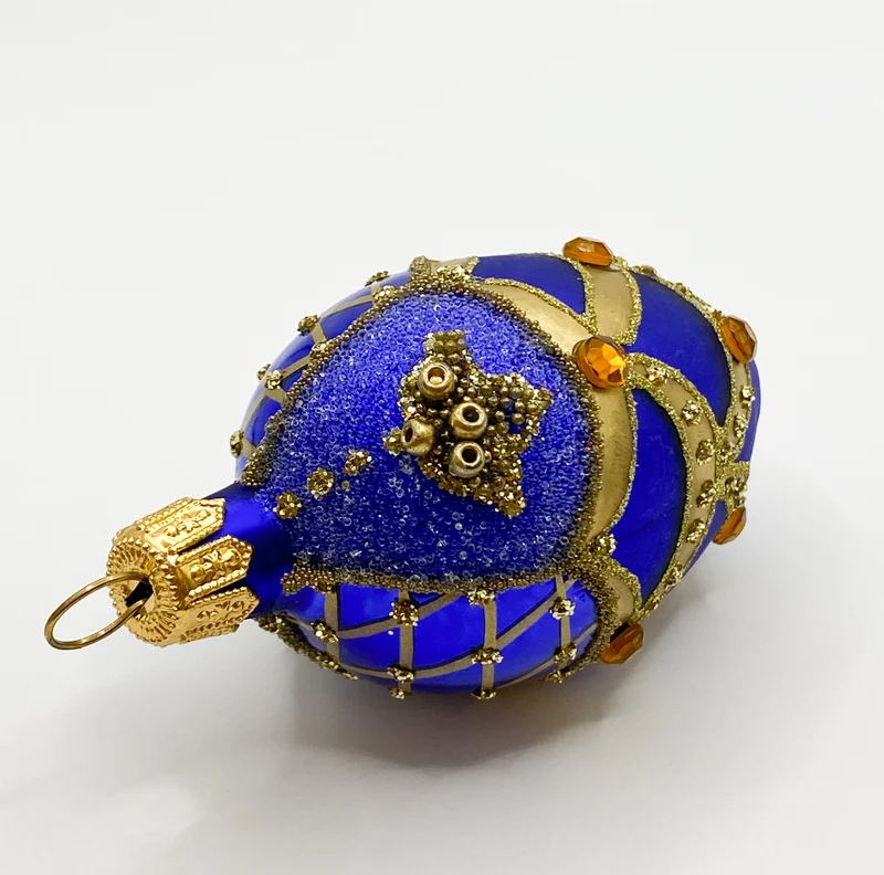 Kleines blaues Ei mit Gold-Dekor