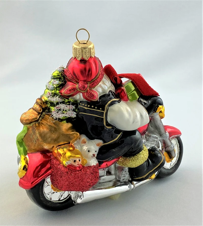 Weihnachtsmann und Wichtel bringen die Geschenke mit dem Seitenwagen-Motorrad