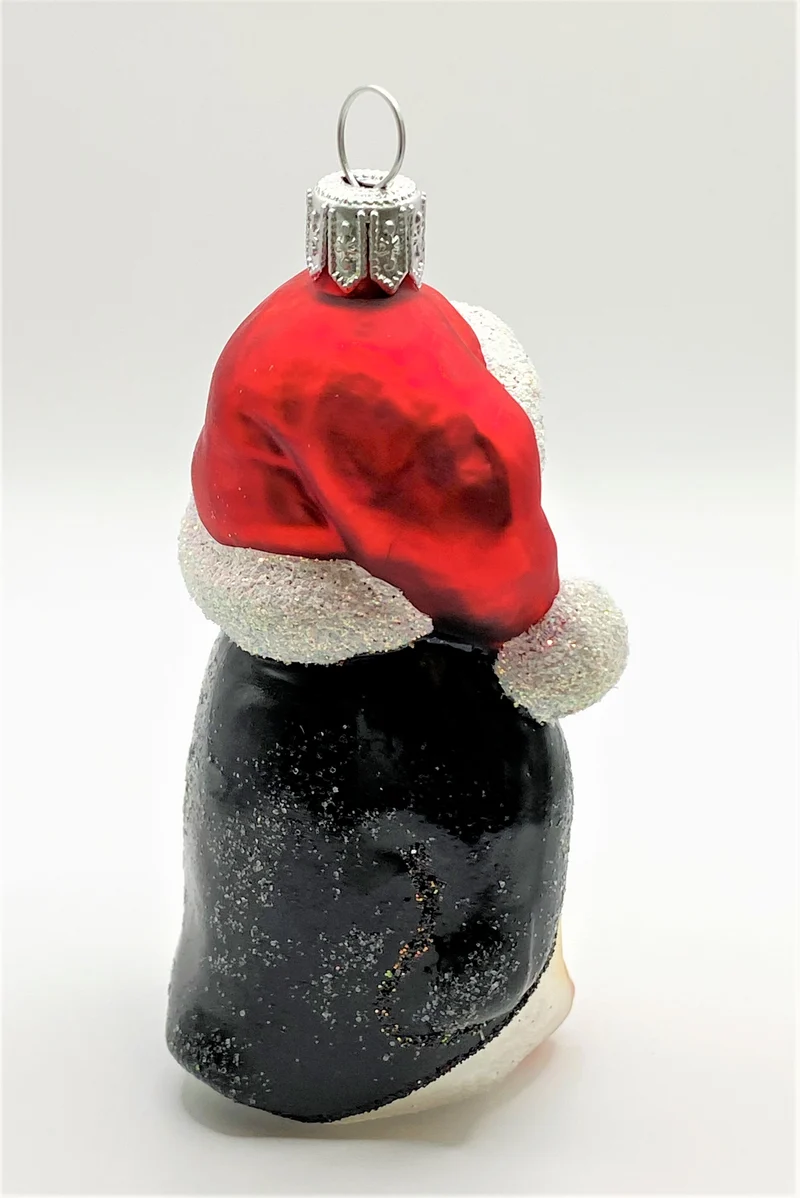 Pinguin mit roter Pudelmütze