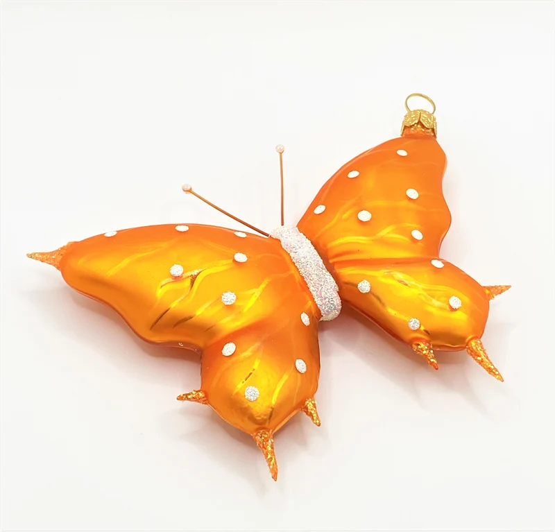 Schmetterling orange, weisse Tupfen